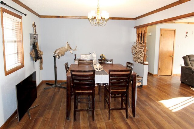 707 S Third St, Cheyenne, OK 73628 - dining area with crown molding, wood finished floors, baseboards, and a chandelier
