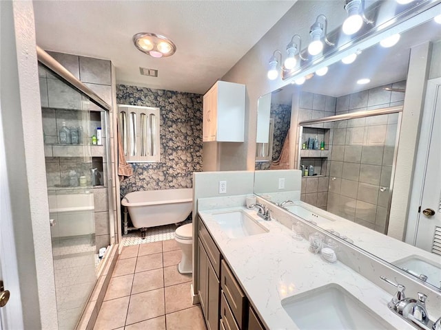 707 S Third St, Cheyenne, OK 73628 - full bathroom featuring tile patterned floors, a stall shower, double vanity, and a soaking tub