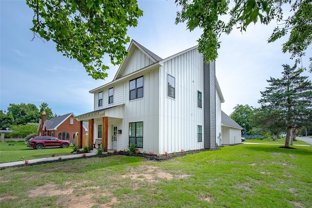 1027 S 7th St, Chickasha, OK 73018 - modern farmhouse featuring board and batten siding and a front yard