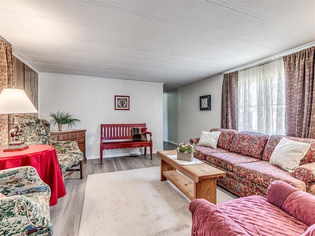 living room featuring light wood finished floors and baseboards