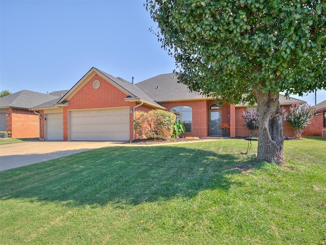 view of front facade with an attached garage, brick siding, driveway, roof with shingles, and a front lawn