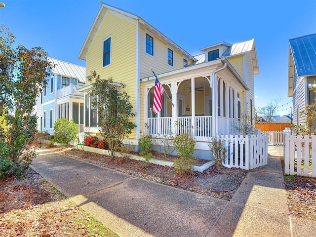 20 Redbud Ln Unit B, Carlton Landing, OK 74432 - view of front of property featuring covered porch, a ceiling fan, a standing seam roof, fence, and metal roof