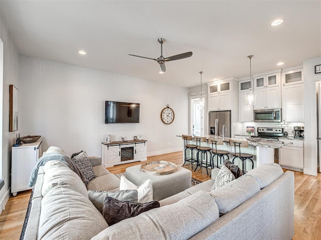 20 Redbud Ln Unit B, Carlton Landing, OK 74432 - living room with light wood-type flooring, baseboards, a ceiling fan, and recessed lighting