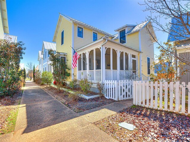 20 Redbud Ln Unit B, Carlton Landing, OK 74432 - view of front of house with a sunroom and a fenced front yard