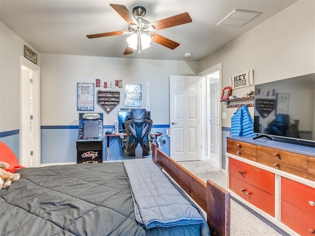 bedroom featuring a ceiling fan, visible vents, and carpet flooring