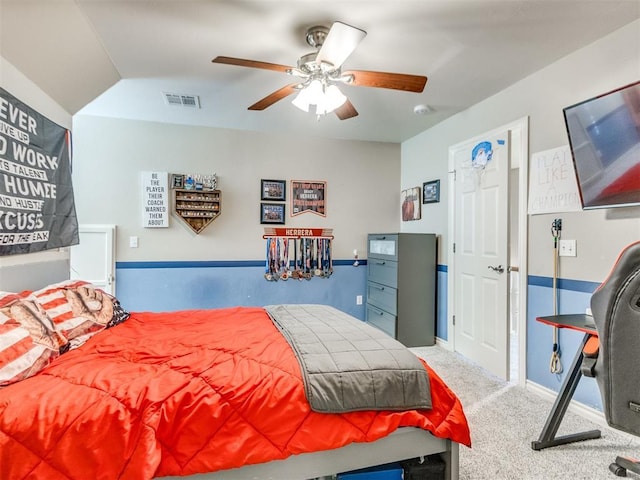 bedroom with carpet floors, baseboards, visible vents, and a ceiling fan