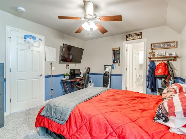 bedroom with a ceiling fan, carpet flooring, and ensuite bathroom