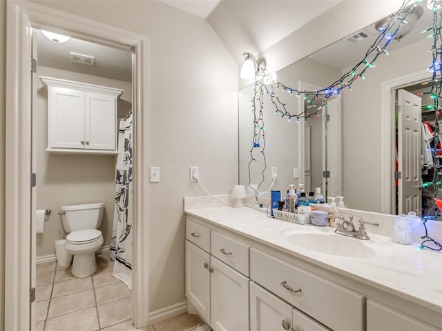 bathroom with tile patterned flooring, visible vents, vanity, and toilet