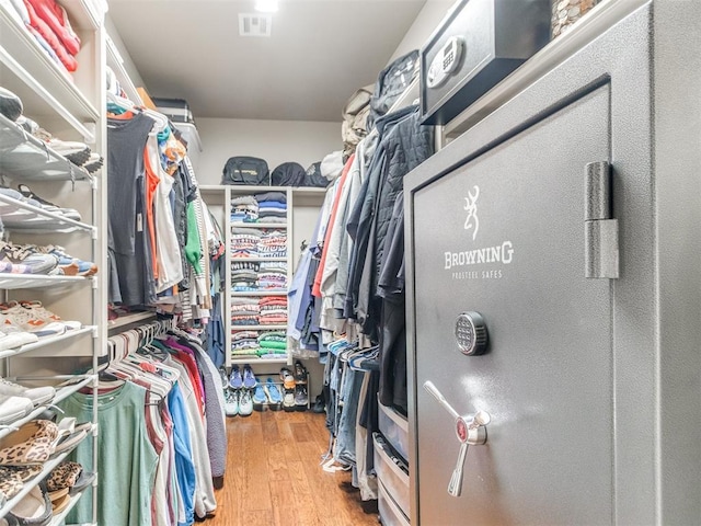 walk in closet featuring wood finished floors and visible vents