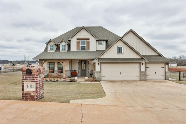 view of front of house with driveway, roof with shingles, covered porch, fence, and a front lawn