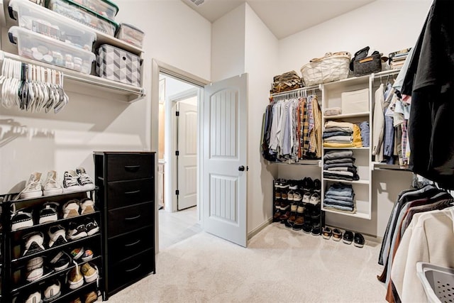 spacious closet featuring light carpet and visible vents