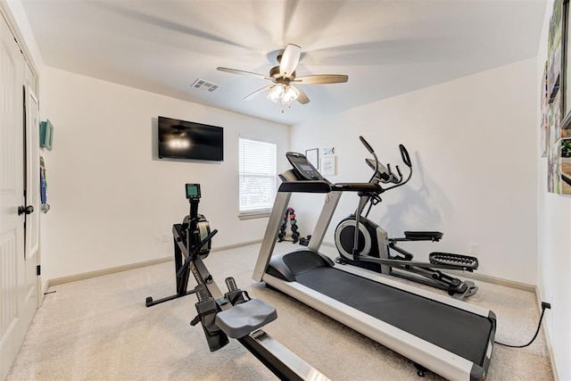 workout area with ceiling fan, light carpet, visible vents, and baseboards