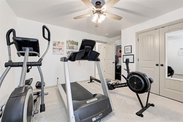 workout room featuring a ceiling fan and light colored carpet