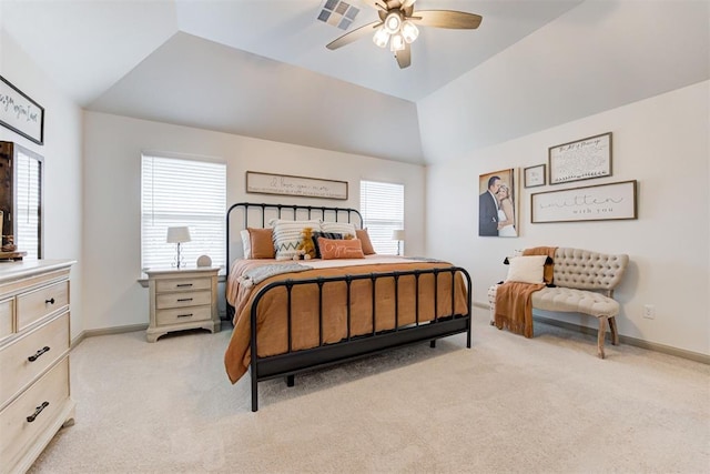 bedroom with baseboards, light colored carpet, vaulted ceiling, and a ceiling fan