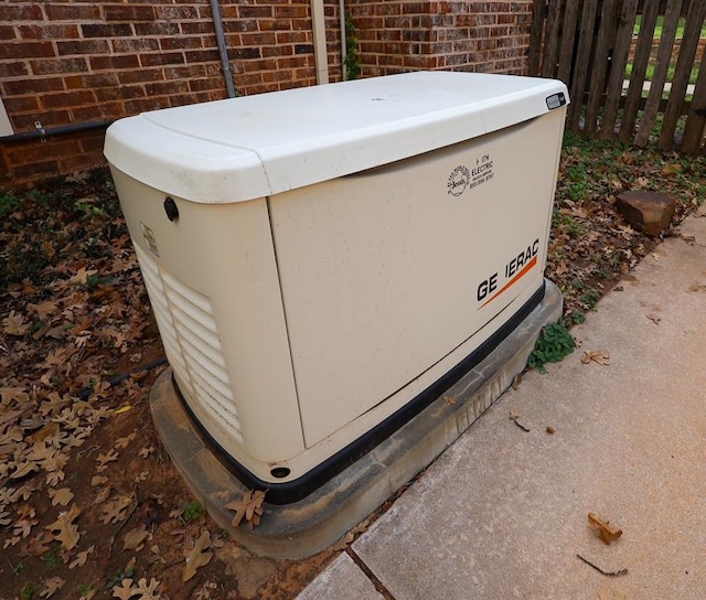 exterior details with brick siding, fence, and a power unit