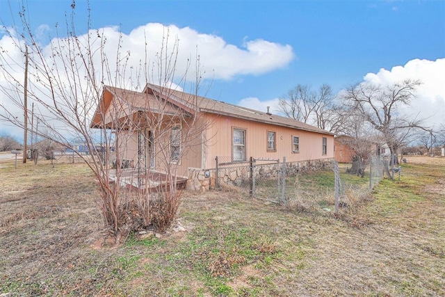 view of home's exterior featuring fence