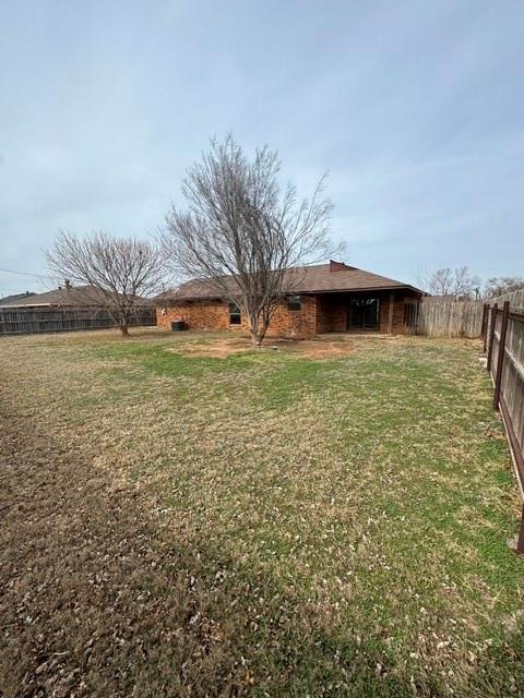 view of yard with a fenced backyard