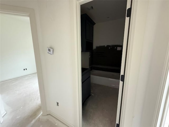 3438 NW 178th Ter, Edmond, OK 73012 - hallway with concrete flooring