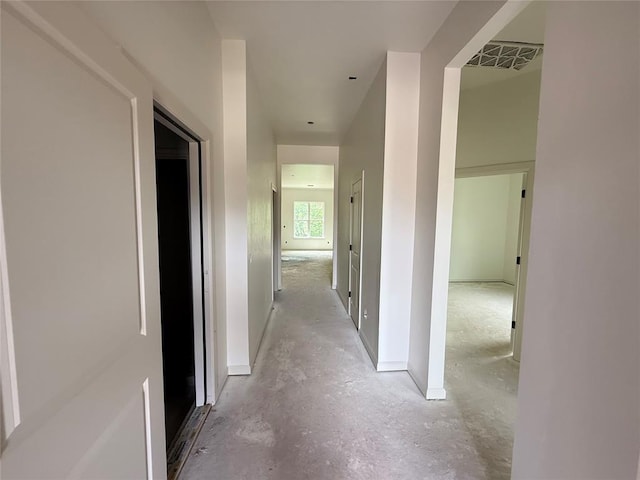 3438 NW 178th Ter, Edmond, OK 73012 - hallway featuring unfinished concrete floors and baseboards