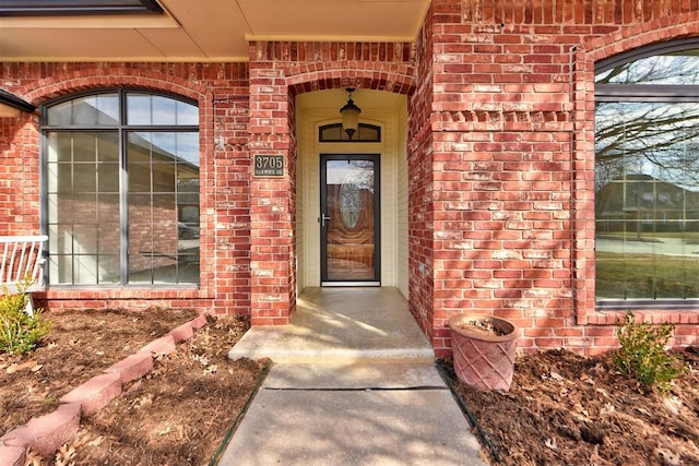 entrance to property with brick siding