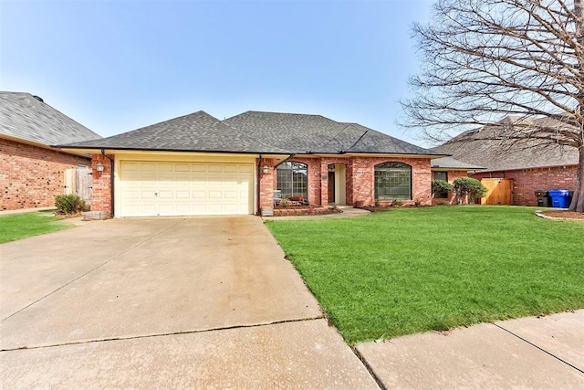 3705 Barwick Dr, Norman, OK 73072 - view of front facade with driveway, a garage, brick siding, and roof with shingles