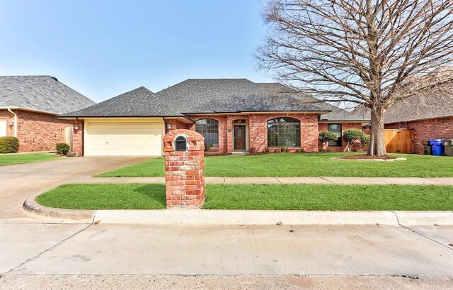 3705 Barwick Dr, Norman, OK 73072 - view of front facade featuring an attached garage, driveway, a shingled roof, and brick siding