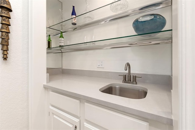 bar featuring a sink and wet bar