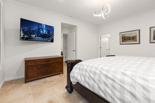 bedroom featuring ornamental molding and baseboards