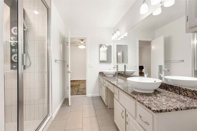 full bathroom featuring double vanity, tile patterned flooring, and a sink