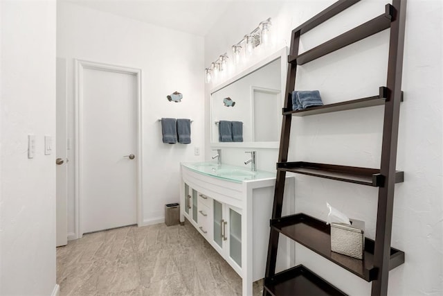 full bathroom featuring a sink and double vanity