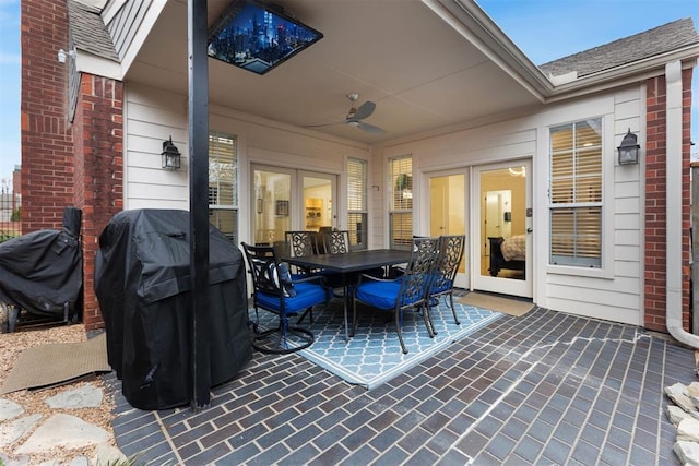 view of patio featuring outdoor dining area, ceiling fan, and area for grilling