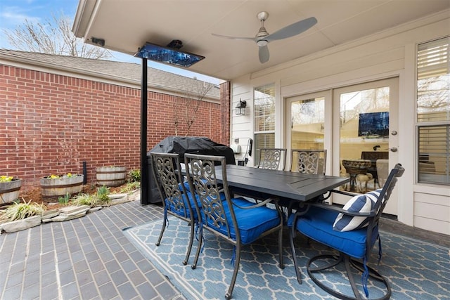 view of patio / terrace with a ceiling fan and outdoor dining space