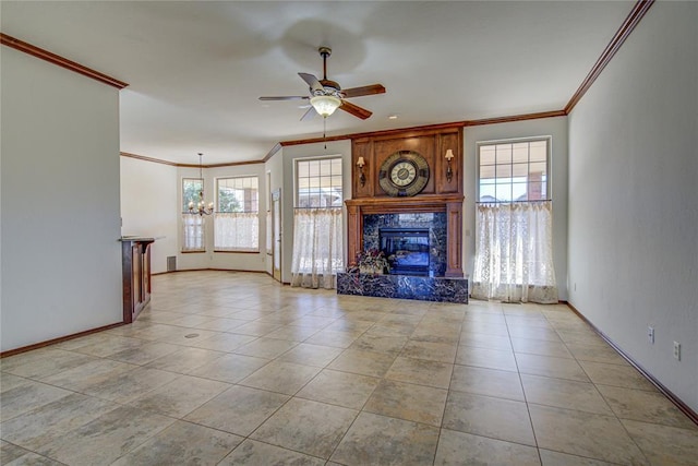 unfurnished living room featuring light tile patterned floors, a premium fireplace, crown molding, and ceiling fan with notable chandelier