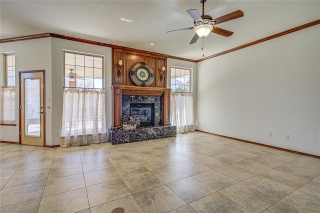 unfurnished living room with tile patterned flooring, baseboards, ornamental molding, and a ceiling fan