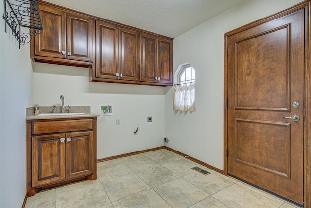 laundry area featuring washer hookup, cabinet space, hookup for an electric dryer, a sink, and baseboards