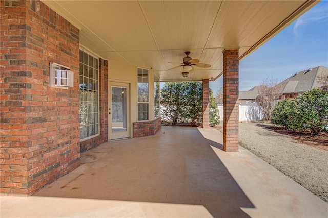 view of patio featuring a ceiling fan and fence