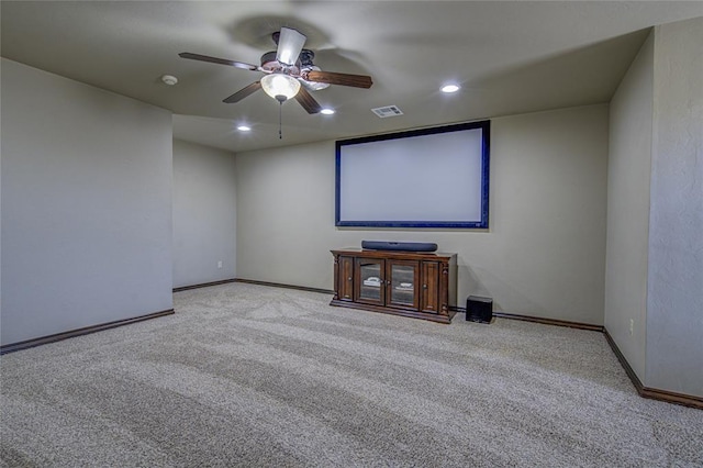 home theater featuring light carpet, ceiling fan, baseboards, and recessed lighting