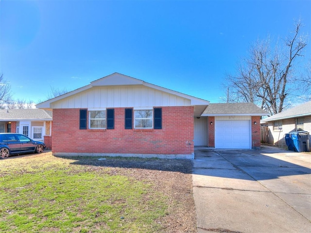 ranch-style house with a garage, brick siding, and driveway