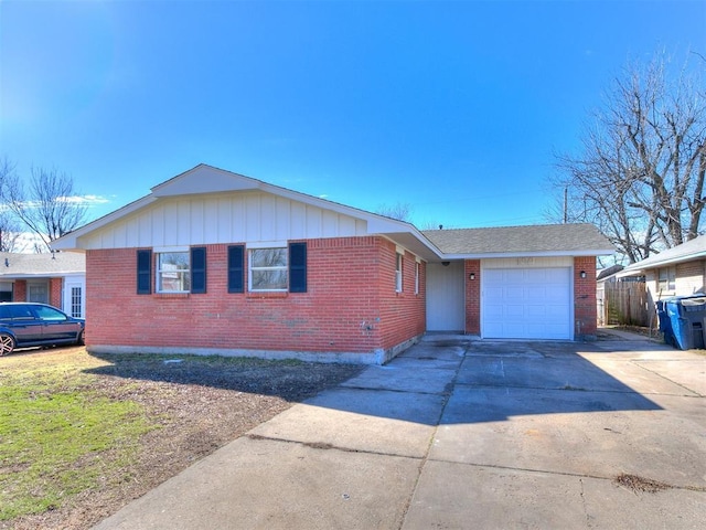 single story home with concrete driveway, brick siding, and an attached garage