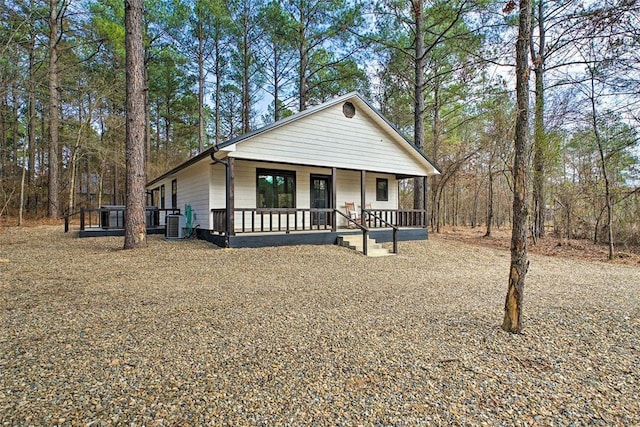 view of front of property featuring a porch and cooling unit