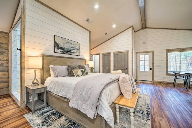 bedroom with visible vents, wooden walls, wood finished floors, high vaulted ceiling, and beamed ceiling