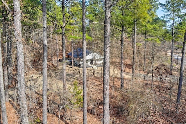 exterior space featuring a view of trees