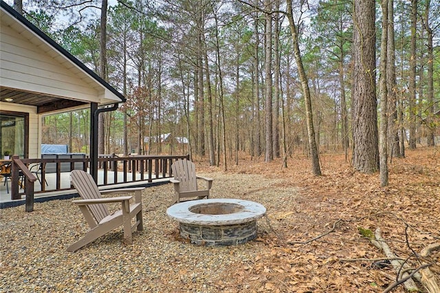 view of yard with a fire pit