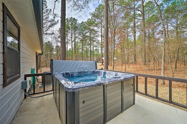 view of patio / terrace with a hot tub