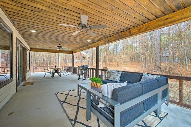 view of patio / terrace with outdoor dining space, outdoor lounge area, and a ceiling fan