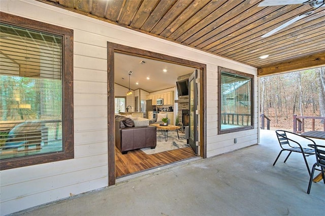 exterior space with wood ceiling