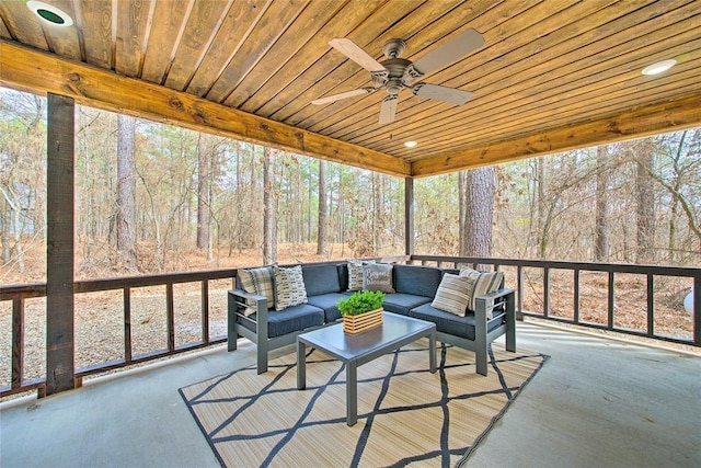 sunroom / solarium with wooden ceiling and a ceiling fan