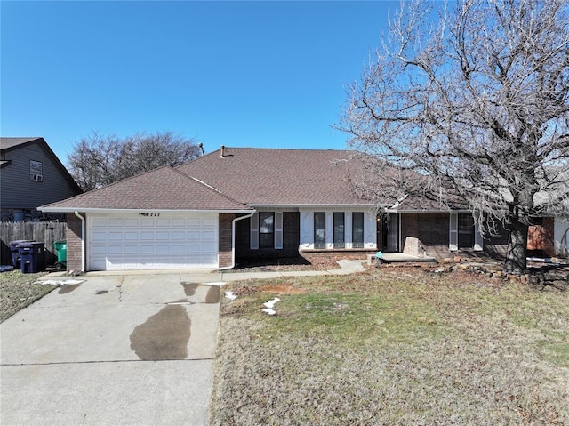 ranch-style home with concrete driveway, brick siding, an attached garage, and a front lawn