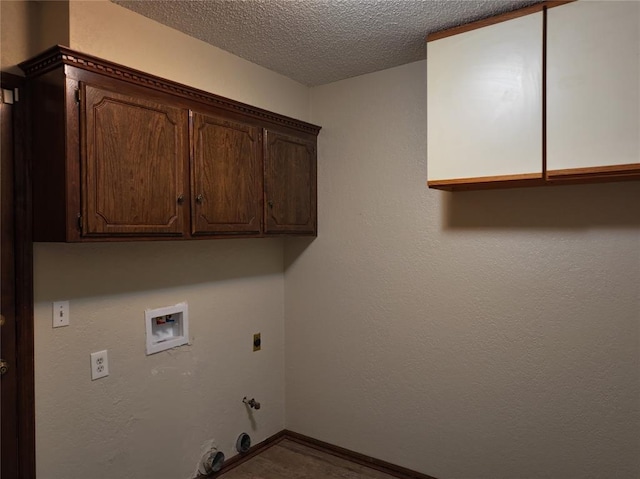 washroom featuring a textured ceiling, hookup for an electric dryer, hookup for a gas dryer, washer hookup, and cabinet space