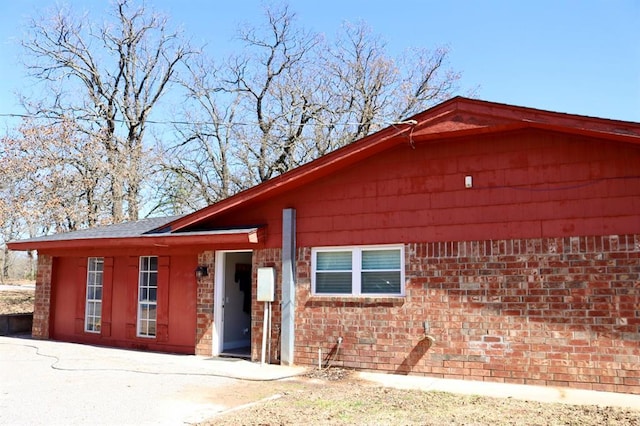 view of front of house featuring brick siding